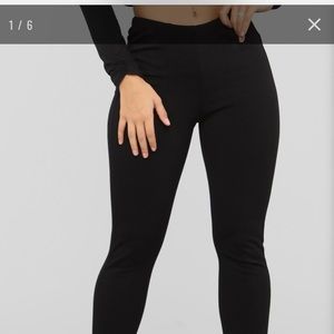 Stretchy, black, slip on, split hem pants.